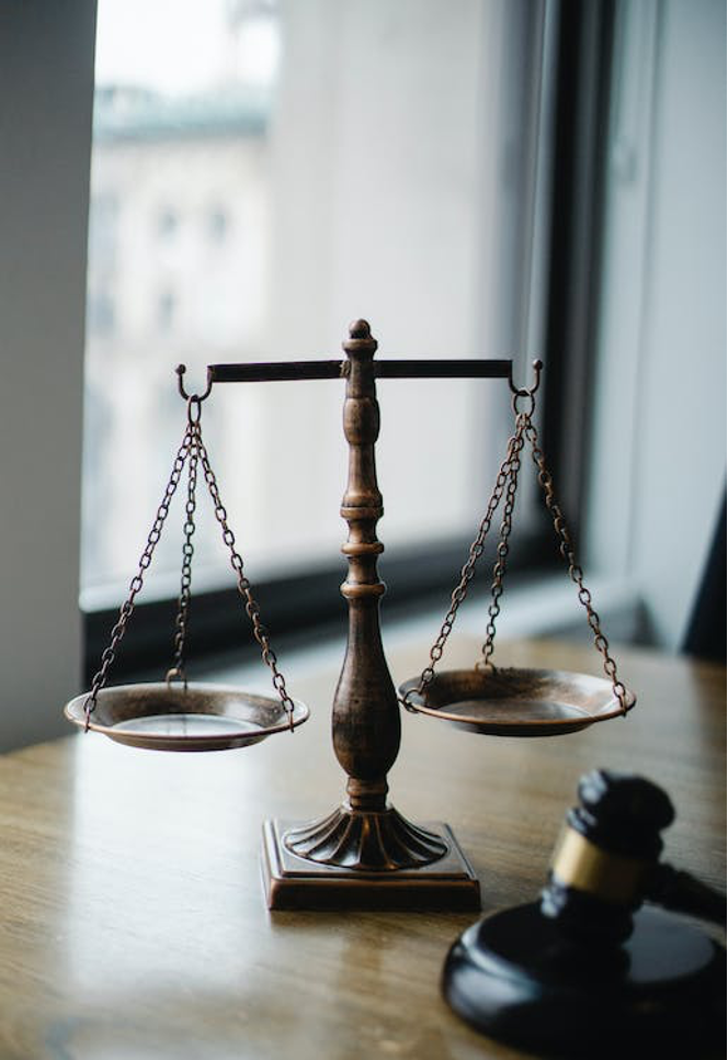 a judgment scale and gavel in a judge's office