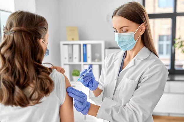 Top Vaccine & Injection Services in Houston Nurse administering vaccine to patient at Houston urgent care