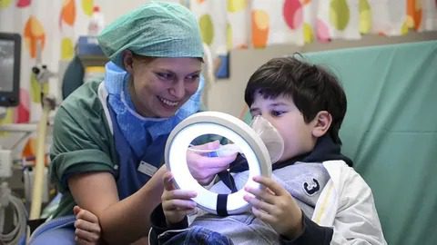 Pediatric dentist in Montclair providing sedation dentistry for a calm, relaxed child