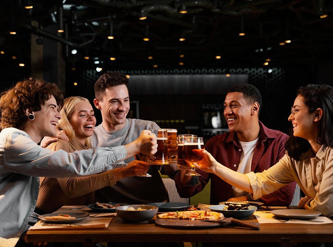 A group of friends drinking and having a fun night out in a bar